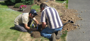 two of our techs are working on a sprinkler repair in Hallandale Beach